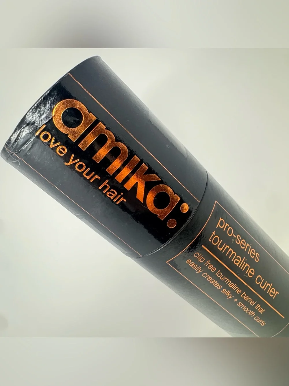 Amika: pro-series tourmaline curler 19mm. Never used. Comes with heat glove.